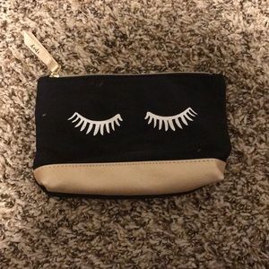 Gold and black makeup bag